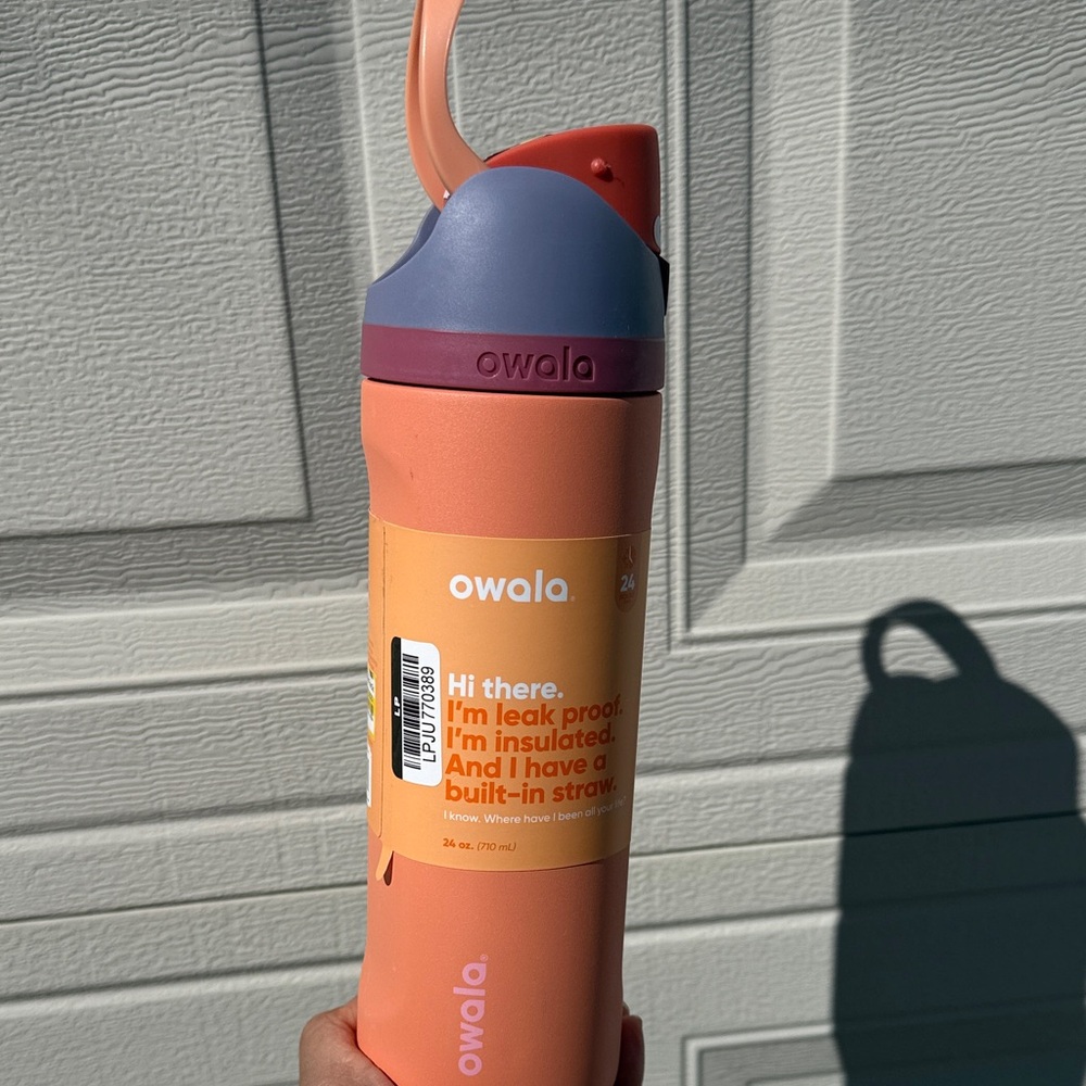 Owala Insulated Water Bottle in Coral with Purple Lid